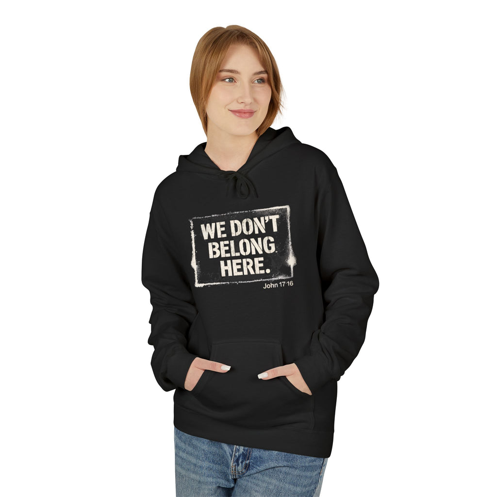 We Don’t Belong Here Hoodie — Christian Faith Graphic Pullover (John 17:16)